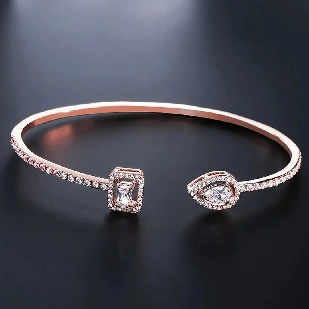 Bracciale Rigido Aperto Dorato a Due Pietre