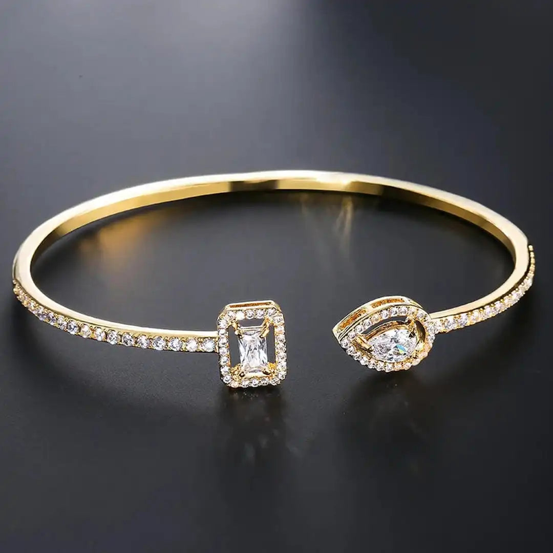 Bracciale Rigido Aperto Dorato a Due Pietre